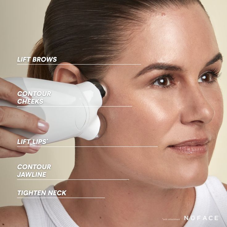 A women holding NuFACE Trinity Facial Toning Device 