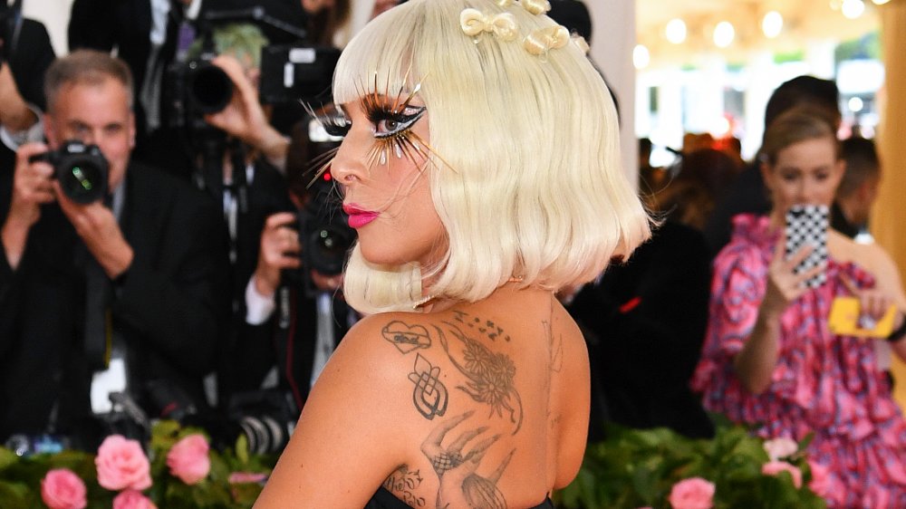 Lady Gaga's growing tattoo collection with bold make up
